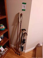 All four items leaning against wall to show full length