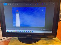 Front view showing display of lighthouse image on screen