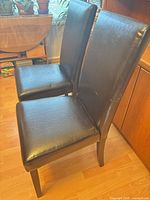 Front angle view of both chairs showing overall design and condition