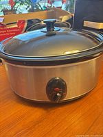 Slow cooker with lid showing exterior and control dial
