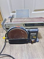 Front view showing belt and disc assemblies