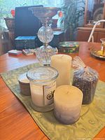 Front view of holder and all five candles on table