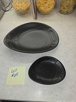 Large and small black bowls overview