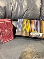 Front view of both DVD box sets