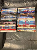 All 34 DVD cases stacked to show spines and titles