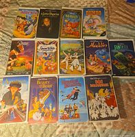 All thirteen VHS tapes laid out showing front artwork