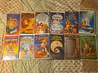 All 12 VHS tapes laid out on bedspread