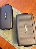 Two closed black Conair hard cases