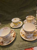 All four teacup and saucer sets grouped