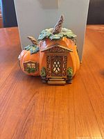 Front view of small pumpkin cottage tealight holder