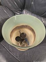 Top view showing metal three-cup tealight insert inside glass holder