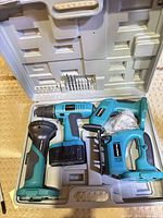 Full set in carry case: drill, jigsaw, sander, flashlight, bits