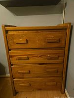 Front view of Sears solid wood 4-drawer dresser