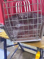 Front view showing metal wire door and interior