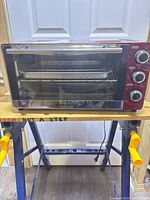 Front view showing controls, door, and interior rack