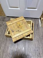 Crate with lid removed showing interior and lid markings