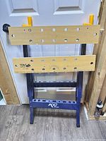 Front view showing KC Pro logo, wooden clamping surfaces with bench dogs