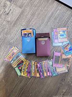 Overview of two deck boxes and loose Yu-Gi-Oh! cards