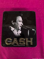 Tin case lid showing Johnny Cash image and title