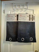 Front view of both folded panels with packaging showing brand and grommets