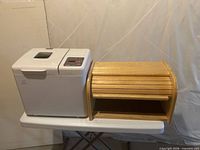 Bread machine and bread box side by side for scale and completeness