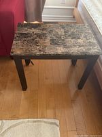 Rectangular side table with marble-look laminate top and dark legs