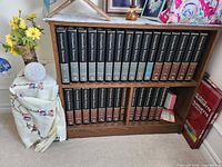 Full set of 30 Encyclopaedia Britannica volumes on bookshelf