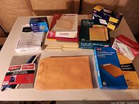 Table view of all envelope boxes, loose envelopes and report covers