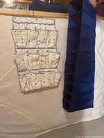 Navy blue cubby organizer and white pocket organizer side by side