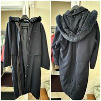 Front and back views of black long parka coat with hood and fur trim