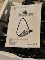 Instruction manual cover showing SteamShark EP903 branding