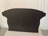 Cargo area liner showing Subaru logo and honeycomb texture