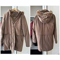 Front and back views of taupe parka on hanger showing hood with faux fur trim, zipper and snap closures, pockets, and overall condition