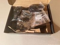 Open box with mount components and hardware bags