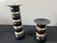 Both candle holders side by side showing relative heights and design