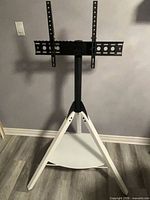 Full view of AVF Hoxton tripod TV stand assembled
