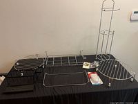 Full lot view with chrome racks, baskets, tower, and packaged items