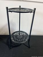 Full view of black metal 2-tier plant stand