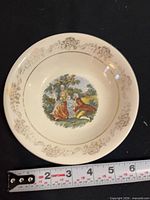 Top view of saucer with ruler showing ~6 inch diameter