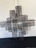 Front view showing full geometric wicker wire sculpture