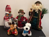 Group shot of all five Christmas plush and fabric figures