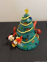 Full view of Christmas tree bucket with Mickey figure