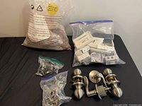Overview of all items including door sets, white plates, fastener bags and lava rock bag