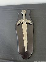 Dagger mounted on wall plaque, full view