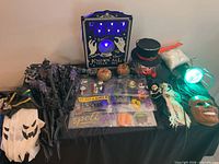 Overall lot showing sign, stakes, decals, masks, spotlight