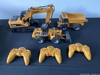 Overall view of three RC vehicles and three controllers