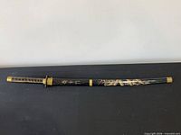 Sword in scabbard, full view