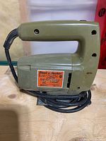 Left side view of Black & Decker 7504-04 jig saw showing body and handle