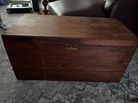 Front view of closed pine blanket chest
