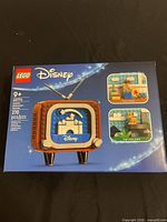 Front of sealed LEGO Disney 40774 box showing TV build and piece count